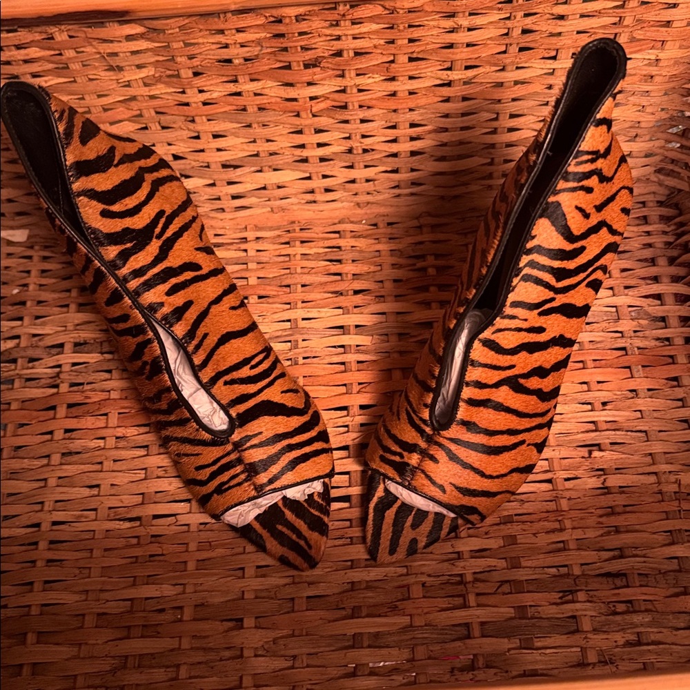 Tiger Stripped beautiful tan and black real feel fur 4” heels never been worn.